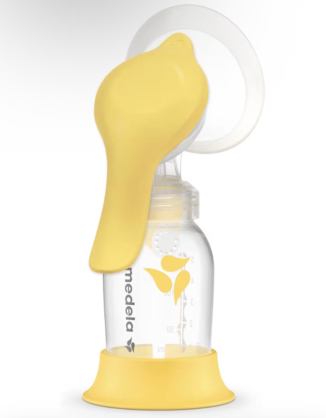 Medela Manual Breast Pump with Yellow Handle and Bottle